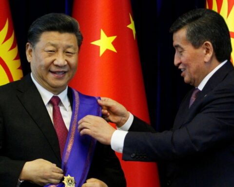Sooronbai Jeenbekov (right) awards Chinese President Xi Jinping