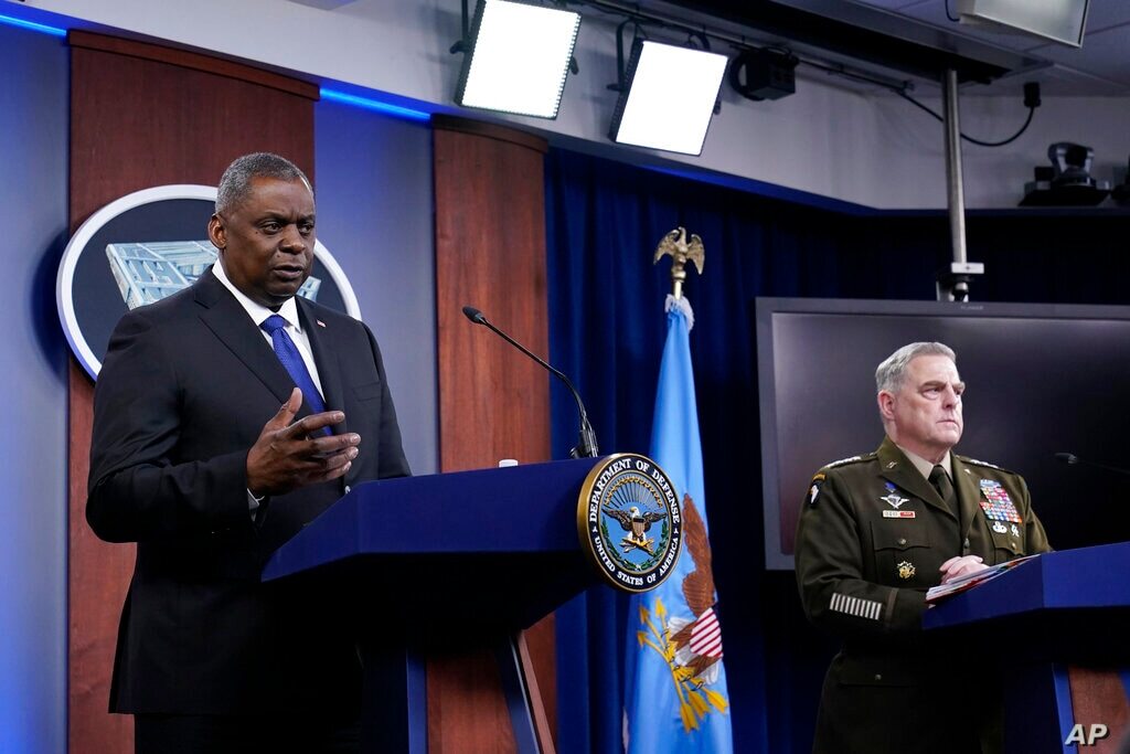 Defense Secretary Lloyd Austin, left, and Chairman of the Joint Chiefs