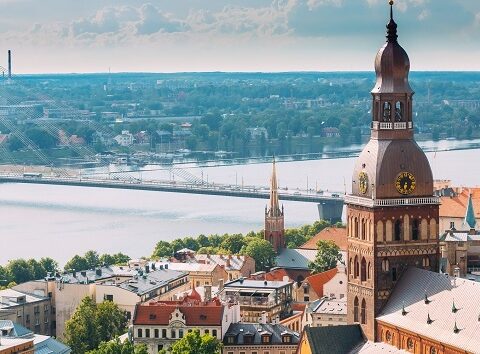 Riga, Latvia. Cityscape In Sunny Summer Day. Famous Landmark - Riga Dome Cathedral