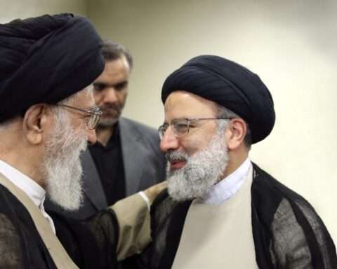 Iranian Supreme Leader Ayatollah Ali Khamenei (left) talks to Ebrahim Raisi
