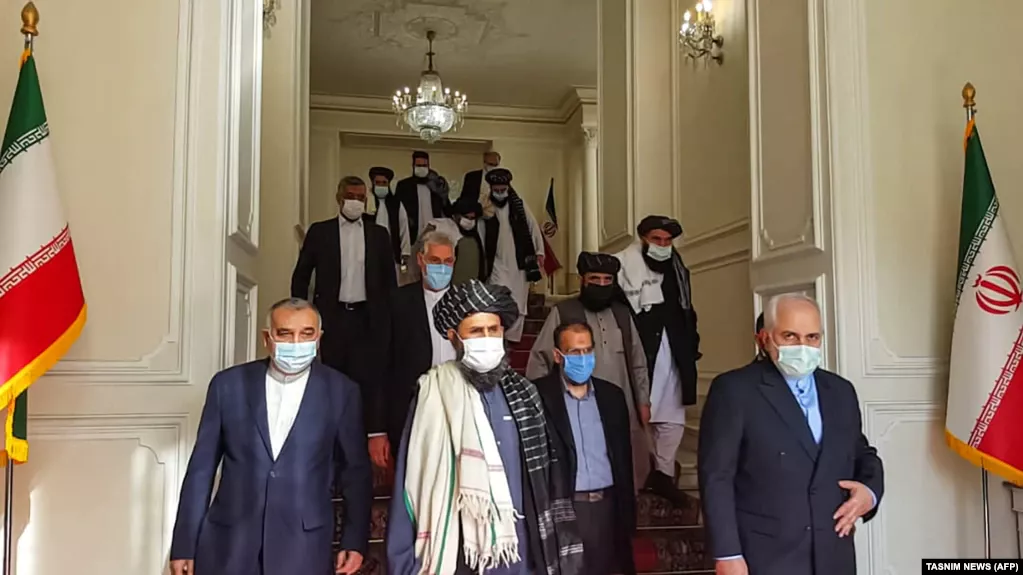 Iranian Foreign Minister Mohammad Javad Zarif (right) meets with senior Taliban leader Mullah Abdul Ghani Baradar