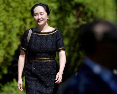 FILE PHOTO: Huawei Technologies Chief Financial Officer Meng Wanzhou leaves her home to attend a court hearing in Vancouver