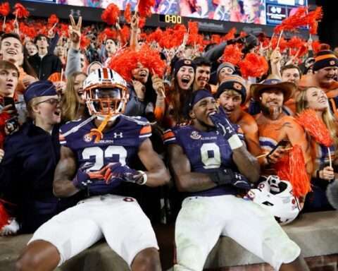 Trey Elston and linebacker Zakoby McClain (9)