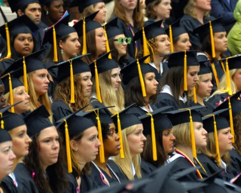 A,Row,Of,Womens,Graaduating,In,With,Some,Male,Graduates