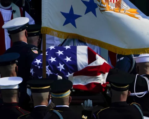 The flag-draped casket of former Secretary of State Colin Powell