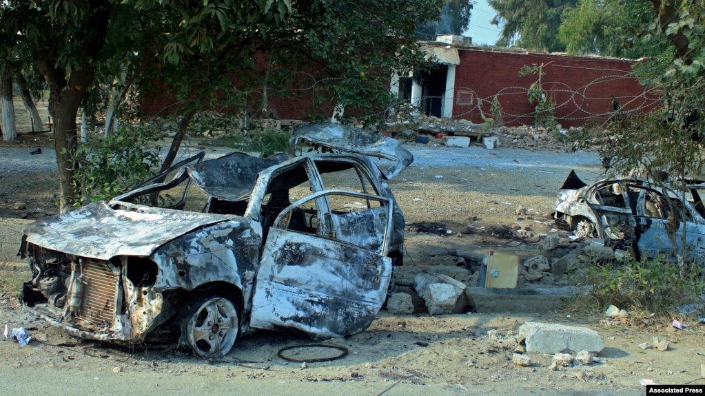 Cars, which were torched by an angry mob