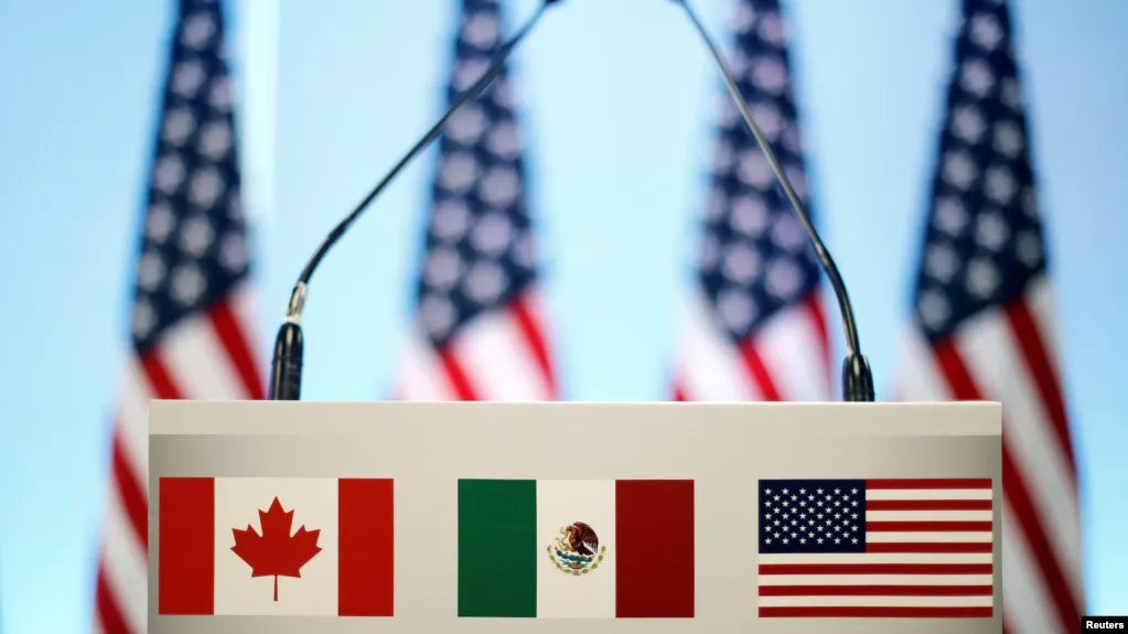 The flags of Canada, Mexico and the U.S. are