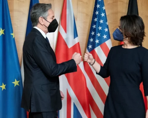 Antony Blinken (left) fist-bumps German Foreign Minister Annalena Baerbock