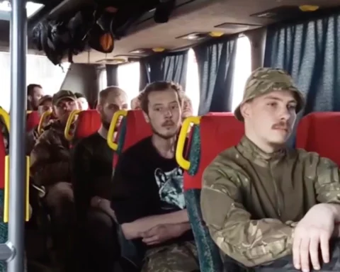 Ukrainian soldiers sit in a bus