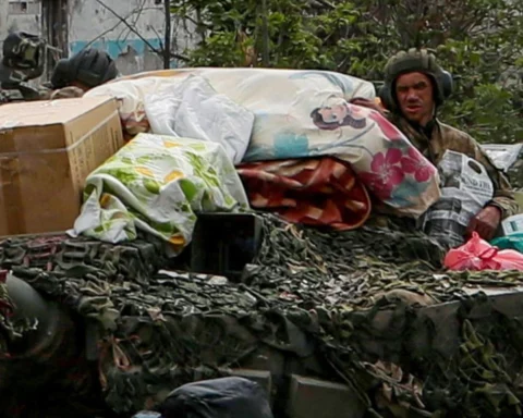 Russian soldiers atop an armored vehicle in the Ukrainian town