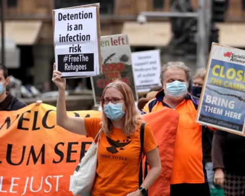 protesters march in Sydney