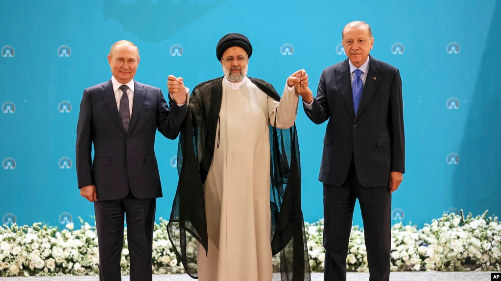Vladimir Putin, left, Iranian President Ebrahim Raisi, center, and Turkish President Recep Tayyip Erdogan