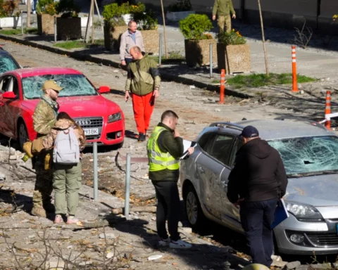 Police inspect and document the scene
